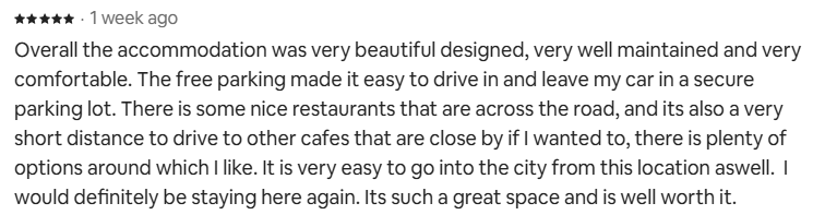 Five-star Airbnb review praising the beautiful design, comfort and free parking